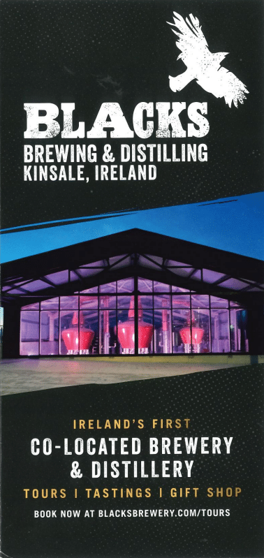 Brochure cover for Blacks Brewing & Distilling in Kinsale, Ireland. It features a modern building illuminated in purple light, highlighting Ireland's first co-located brewery and distillery. Tours, tastings, and a gift shop are available.